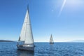 Yachting. Tourism. Luxury Lifestyle. Ship yachts with white sails in the open sea.