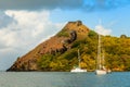 Yachts anchored at the Pigeon Island with fort ruin on the rock, Rodney bay, Saint Lucia, Caribbean sea Royalty Free Stock Photo