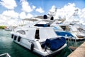 Yachts in bay with cloudy sky