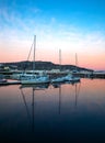 Yachts berthed in the harbor at sunset Royalty Free Stock Photo