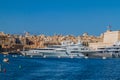 Yachts berthed at the port in Birgu town, Malta. Valletta in the backgroun