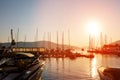 Yachts and boats at Adriatic sea bay at sunset in golden and pink tones. Royalty Free Stock Photo