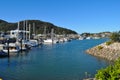 Picturesque marina with boats on moorings and still, calm, water Royalty Free Stock Photo
