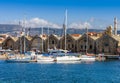 Yachts and boats moored near the Venetian Neoria, Chania, Crete, Greece Royalty Free Stock Photo