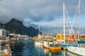 Yachts and boats with mountain in the background at pier in Svolvaer, Lototen islands, Austvagoya, Vagan Municipality, Nordland Royalty Free Stock Photo