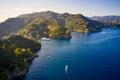 Yachts and boats are sailing in the Ligurian Sea on the mountain background, Portofino, Italy. Rocks and hills seaside with the