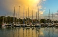 Yachts and boats in the sea bay against the backdrop of the sunset sky Royalty Free Stock Photo