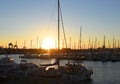 Yachts and boats in silhouette of sunset in Marina.