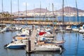 Yachts and boats during a sunny day and palm trees in Las Palmas, Spain