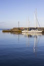 Yachts in the calm waters of Groomsport Harbour in Northern Ireland and pictured in the soft glow of mid winter sunlight