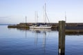 Yachts in the calm waters of Groomsport Harbour in Northern Ireland and pictured in the soft glow of mid winter sunlight