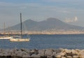 Yachts in dock against Vesuvius volcano. Boats in harbour in Naples Napoli, Italy. Sailing and travel concept. Neapolitan landmark Royalty Free Stock Photo