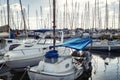 Yachts docked in the marina, bright sunny day