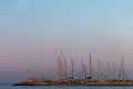 Yachts masts against pink to blue morning sky Royalty Free Stock Photo