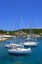 Yachts moored in crystal clear water Royalty Free Stock Photo