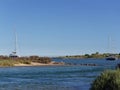 Yachts moored between the Islands of Ilha Da Culatra off the Portuguese Algarve Coast. Royalty Free Stock Photo