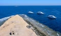 yachts moored to the reef, in front of the lighthouse on Big Brother Island, Red Sea, Egypt Royalty Free Stock Photo