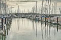 Yachts and motor boats docked in Half Moon Bay marina on a calm day Royalty Free Stock Photo