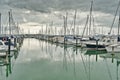 Yachts and motor boats docked in Half Moon Bay marina on a calm day Royalty Free Stock Photo
