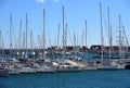 Yachts and motor boats in La Marina de Valencia, Spain. Luxury yacht and fishing motorboat in yacht club at Mediterranean Sea. Royalty Free Stock Photo