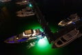 Yachts with neon green underwater lighting Miami aerials