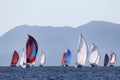 Yachts with opened spinnaker in perspective coming to buoy. Royalty Free Stock Photo