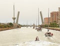 Yachts Passing under a Bridge