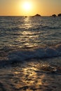 Yachts sail on the sea near a sunny path at sunset. View from the Kabak beach in Turkey. Royalty Free Stock Photo