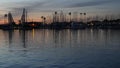 Yachts sailboats in marina harbour. Sail boat masts in twilight. Dusk in harbor, California USA.