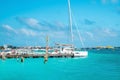 Yachts or sailboats sailing or moored at beautiful turquoise sea water surface