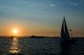 Yachts sailing at sunset
