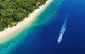 Yachts at the sea in Bali, Indonesia. Aerial view of luxury floating boat on transparent turquoise water at sunny day. Top view fr Royalty Free Stock Photo