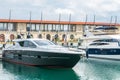 Speed boats at harbor. Power boats moored in marina. Sea coast pier Royalty Free Stock Photo