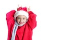 7 yaers old smiling girl with changing tees smiling in santa hat, red pullover, gray scarf, imitation of christmas dear with smile Royalty Free Stock Photo