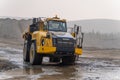 Komatsu HM400 dump truck working in an open pit.