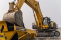 A Komatsu PC1250 excavator loads ore into a Komatsu HM400 dump truck