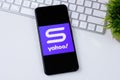 Yahoo Sports app logo on a smartphone screen.