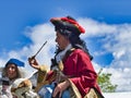 Actor man in historical pirate costume making a show outdoors