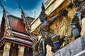 Yak, Yaksha statues with large teeth, piercing eye with protecting and guarding the famous Temple of the Emerald Buddha or Wat Royalty Free Stock Photo