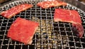 Yakiniku Japanese bbq with red raw beef meat cooking Royalty Free Stock Photo