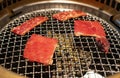 Yakiniku Japanese bbq with red raw beef meat cooking Royalty Free Stock Photo