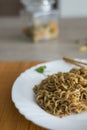 Yakisoba / noodles with beef in plate with bamboo stic