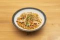 Yakisoba noodles sauteed with carrots, zucchini and chicken strips with poppy seed