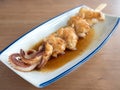 Yakitori: japanese squid skewers in sauce