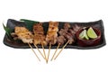 Yakitori Japanese-Style Grilled Chicken Skewers with chicken and internal organ served with sliced lime. Royalty Free Stock Photo