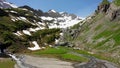 Yaks wading through a mountain river on the alp Geltenalp, Switzerland