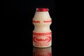 Yakult fermented milk drink on black isolated background Royalty Free Stock Photo