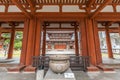 Yakushi-Ji temple. Jokoro incense burner at Chumon gate, Kondo (Main hall) in the back.