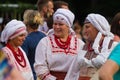 adult women have fun, wear restored ancient clothes of historical region Podillya, Living Fire Pagan Ethno festival