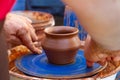 Yakushyntsi, Ukraine, skilful potter hand form a clay bowl on a traditional pottery wheel, ethnography study lesson in making